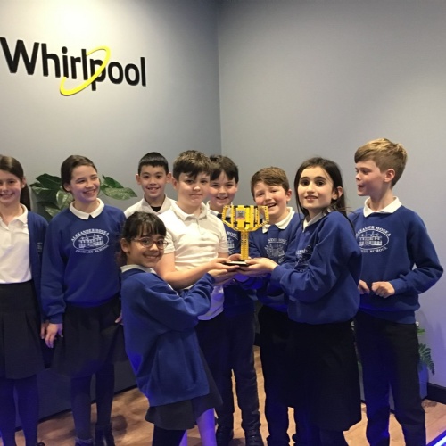 Children receiving an award at the Whirlpool factory